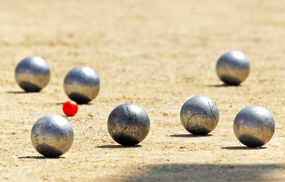 Petanque bowls are seen during the semi-final of the "Mondial La Marseillaise de Petanque" in Marseille July 8, 2010. The game is played on hard dirt or gravel most of the time and occasionally on grass surfaces. Petanque originated from the 1900s in Provence, southern France. REUTERS/Jean-Paul Pelissier (FRANCE - Tags: SPORT SOCIETY)